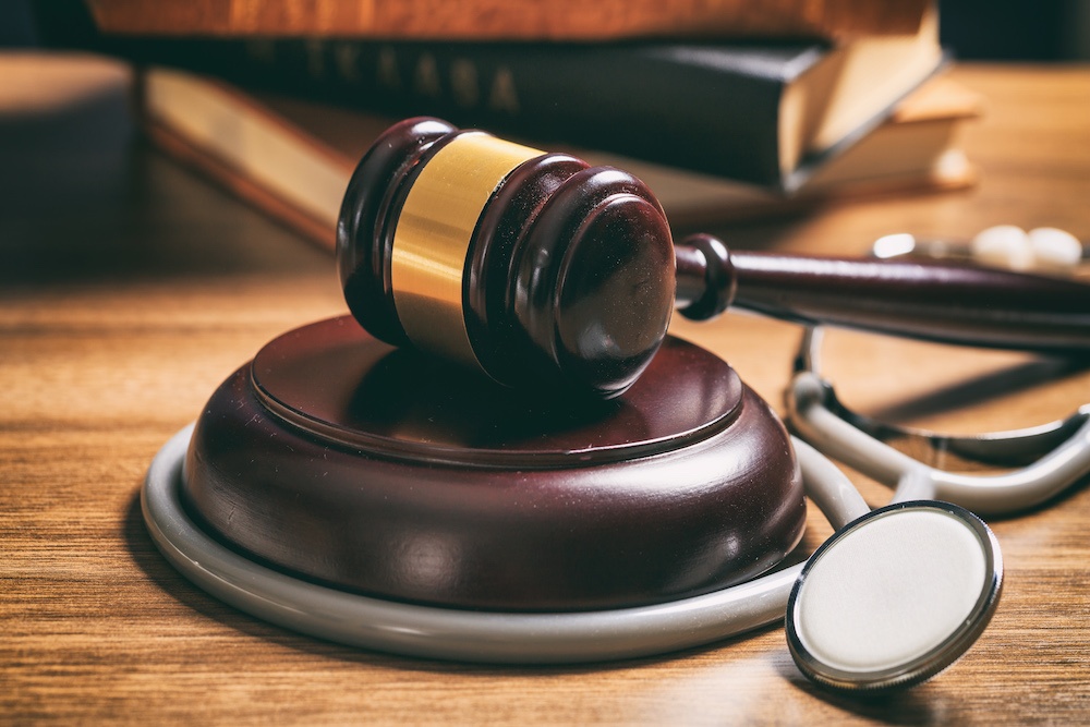 Judge Gavel and a Stethoscope on a Wood desk